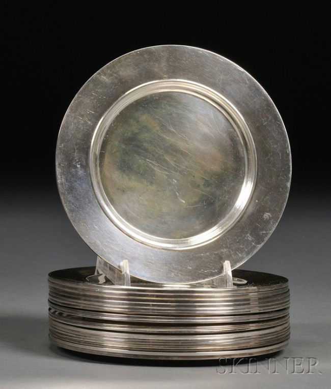 Set of Eighteen Georg Jensen Sterling Side Plates,: Set of Eighteen Georg Jensen Sterling Side Plates, 1915-32, designed by Johan Rohde, no. 587B, with light overall hammered surface, dia. 6 in., approx. 92 troy oz. Provenance: All engraved to undersid