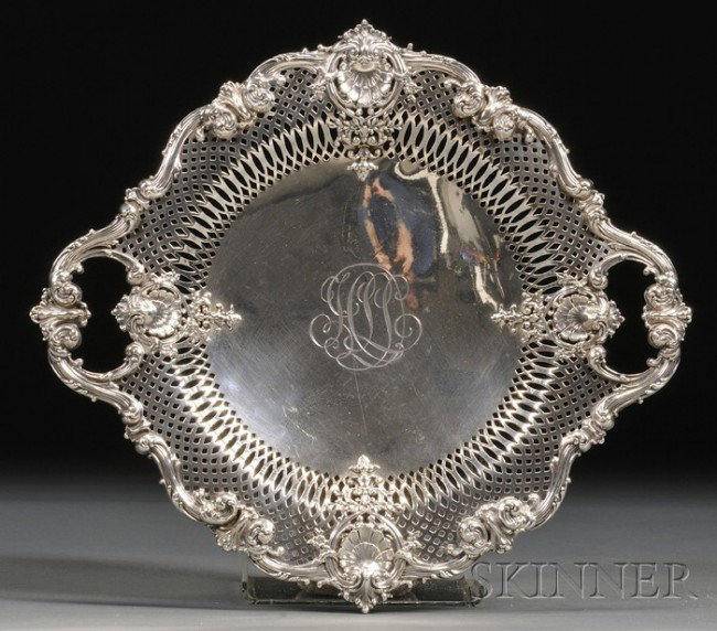 Black, Starr & Frost Sterling Cake Plate, late 19t: Black, Starr & Frost Sterling Cake Plate, late 19th/early 20th century, with reticulated edge and rim applied with rocaille S-scrolls and shells, raised on short rocaille scroll feet, monogrammed, wd.