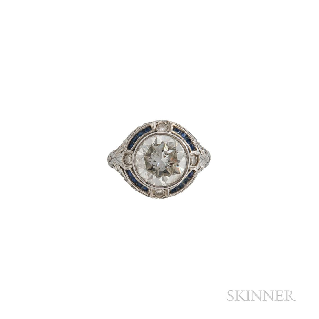 Platinum and Diamond Solitaire, bezel-set with a full-cut diamond weighing approx. 2.90 cts., framed (1 of 2)
