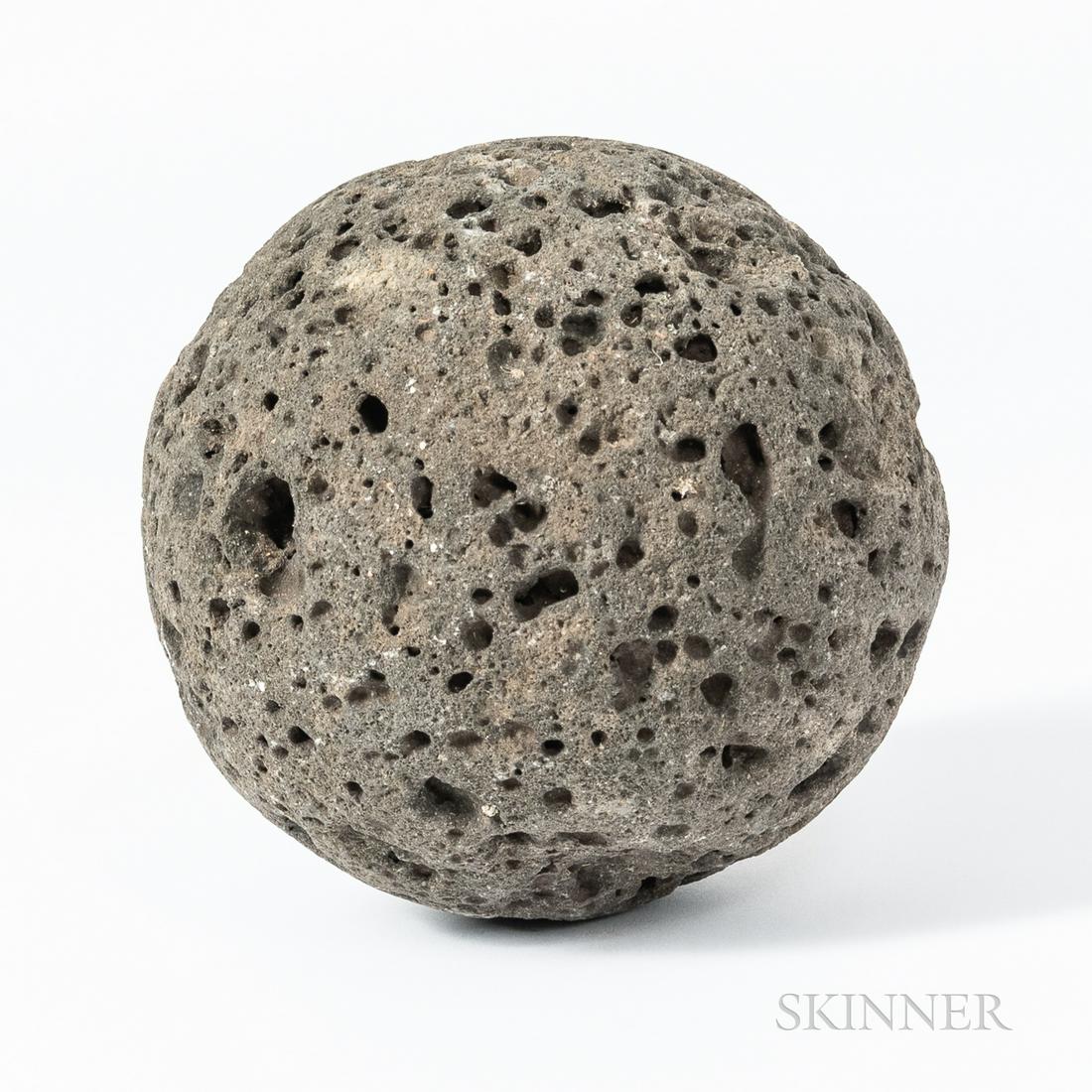 Large Hawaiian Stone Game Ball, 19th century, or earlier, of rough lava stone, used as a kind of (1 of 2)