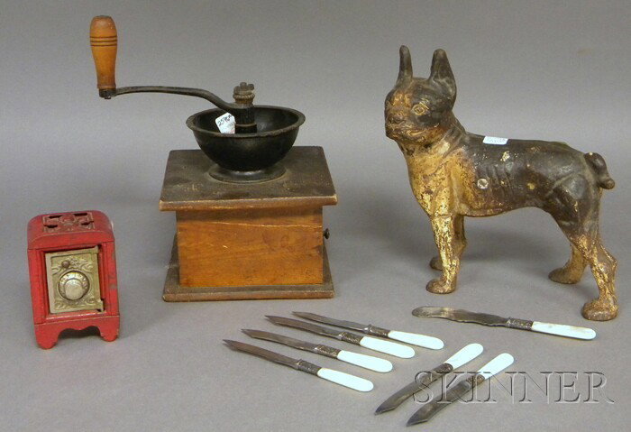 Group of Miscellaneous Items, a painted cast iron : Group of Miscellaneous Items, a painted cast iron Boston Terrier doorstop, a wooden coffee grinder, a Kenton painted metal "safe" coin bank, and a set of seven mother-of-pearl handled silver-plated fr