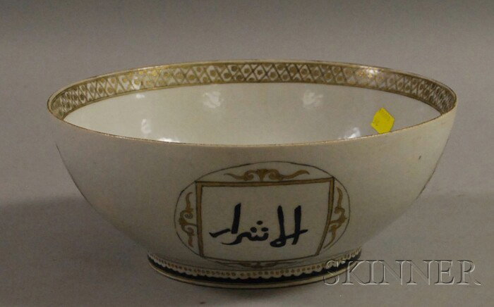 Islamic Black, White, and Gold Porcelain Bowl, dec: Islamic Black, White, and Gold Porcelain Bowl, Chinese, decorated with Arabic script cartouches, gilt floral band inside the top edge, (good condition, some interior wear), ht. 4 1/2, dia. 11 in.