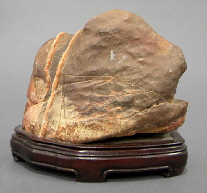 Soapstone Boulder, China, natural shape of a minia: Soapstone Boulder, China, natural shape of a miniature mountain, the stone of red color, wood stand, ht. 5 1/2 in.