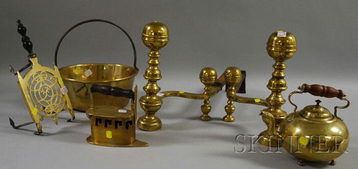 Six Brass Fireplace and Hearth Items, a pair of b: Six Brass Fireplace and Hearth Items, a pair of belted ball-top andirons, a flat iron, trivet, hot water kettle, and pan with iron handle.