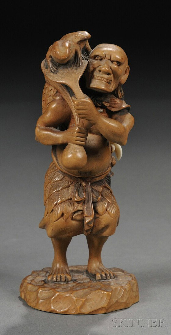 Boxwood Gama Sennin, Japan, 19th century, finely c: Boxwood Gama Sennin, Japan, 19th century, finely carved as the standing figure of gama sennin carrying a basket surmounted by two toads, signed "Mitsukazu," ht. 5 1/2 in.