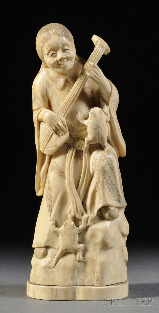 Ivory Carving, Japan, 19th century, carved as a st: Ivory Carving, Japan, 19th century, carved as a standing figure of a female Immortal playing a musical instrument, with frogs crawling on her robe, ht. 8 1/2 in.