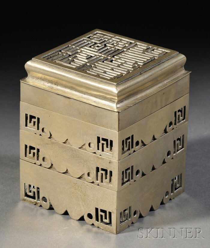Brass Incense Clock, China, 19th century, the thre: Brass Incense Clock, China, 19th century, the three tiered rectangular incense burner with a lid in reticulated design of four auspicious characters, ht. 3 1/2, sq. 2 3/4 in.