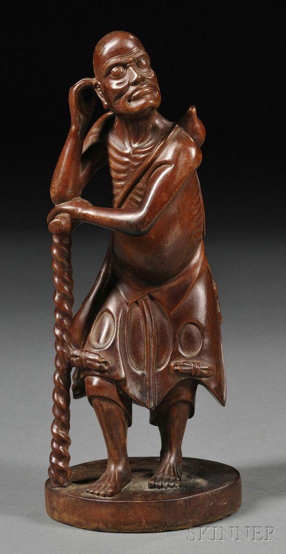 Bamboo Luohan, China, carved as the standing figur: Bamboo Luohan, China, carved as the standing figure of a Luohan carrying a double gourd on his back and leaning on a walking cane, ht. 9 1/8 in.