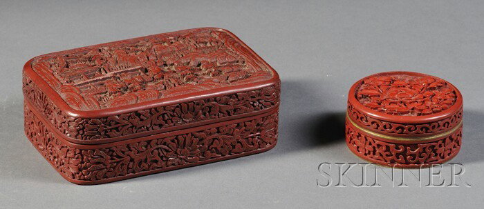 Two Cinnabar Boxes, China, a 19th century rectangu: Two Cinnabar Boxes, China, a 19th century rectangular box carved in relief with scholars and attendants in a serene landscape, with lotus scrolls to the sides, and a circular cosmetic box with peony b