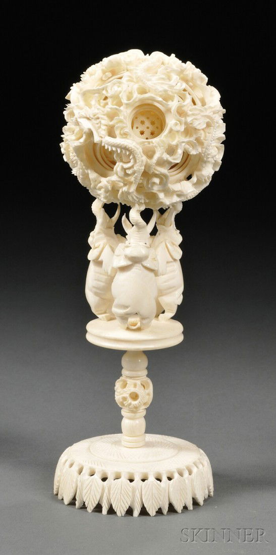 Ivory Puzzle Ball, Zhuanxinqiu, China, 19th centur: Ivory Puzzle Ball, Zhuanxinqiu, China, 19th century, the outer sphere carved and pierced with a scaly dragon amidst clouds, with fourteen circular apertures revealing each concentric sphere within, su