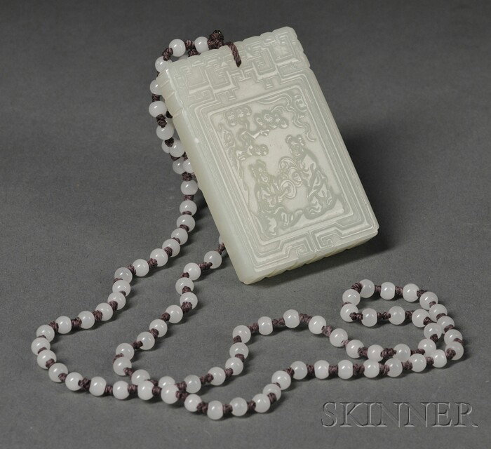 Jade Plaque, China, the thick rectangular plaque c: Jade Plaque, China, the thick rectangular plaque carved in low relief with two boys playing gong under a pine tree, and bats and a peach spray to the back, scroll borders, the stone of gray-celadon co