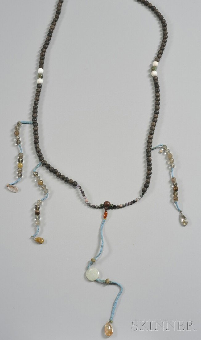 Beaded Necklace, China, early 20th century, sandal: Beaded Necklace, China, early 20th century, sandalwood beaded necklace interspersed with jade, glass, quartz beads, suspending a pale celadon jade pendant, (hanging) lg. 50 in.