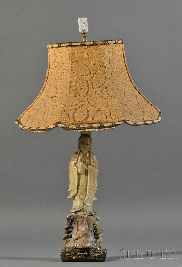 Soapstone Guanyin, China, the standing figure of G: Soapstone Guanyin, China, the standing figure of Guanyin, mounted in bronze as a lamp, with a jade plaque finial, ht. 13 1/2 in.