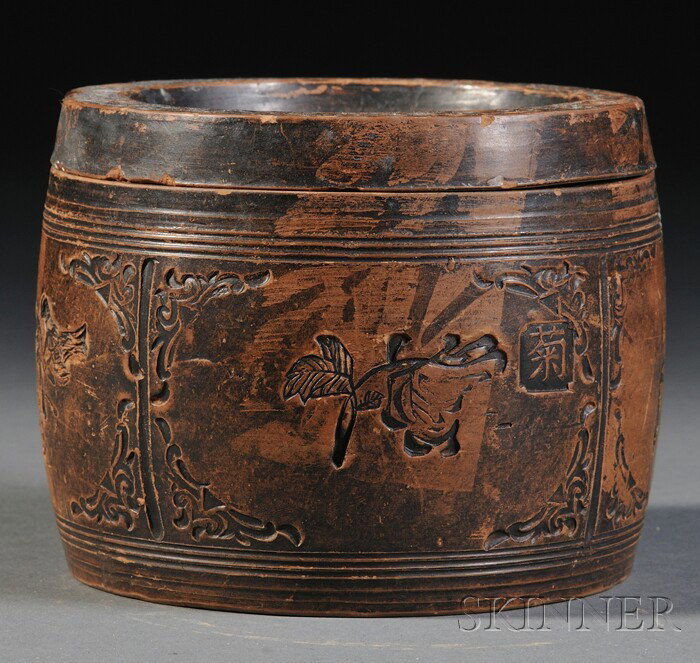 Soapstone Box, China, the drum-shaped body carved: Soapstone Box, China, the drum-shaped body carved with four panels enclosing iris, bamboo, chrysanthemum, and plum branches, with cover, the base carved with "Da Qing Xianfeng san nian, Yuan Yongqing