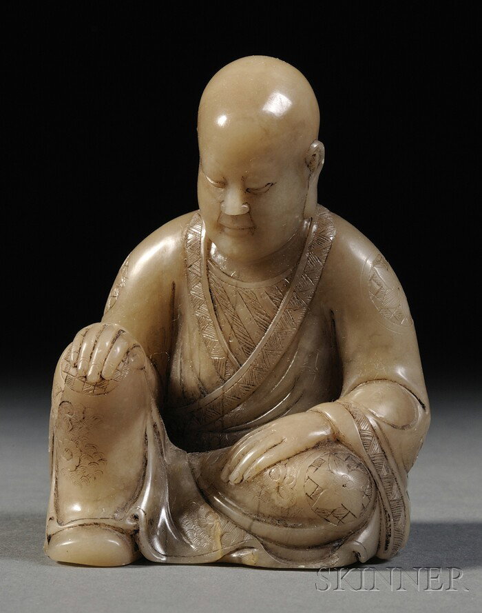 Soapstone Luohan, China, finely carved as the seat: Soapstone Luohan, China, finely carved as the seated figure of Luohan with both hands resting on his knees, with an contemplative expression, the stone of gray-white color, ht. 3 1/8 in.