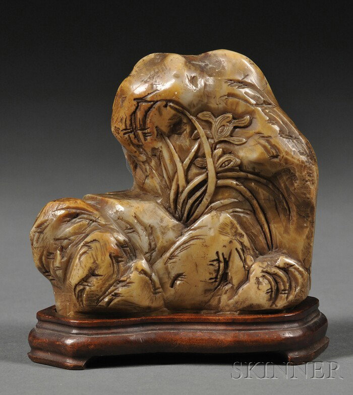 Soapstone Mountain, China, carved in relief with i: Soapstone Mountain, China, carved in relief with iris branches to both sides, wood stand, ht. 3 1/2 in.