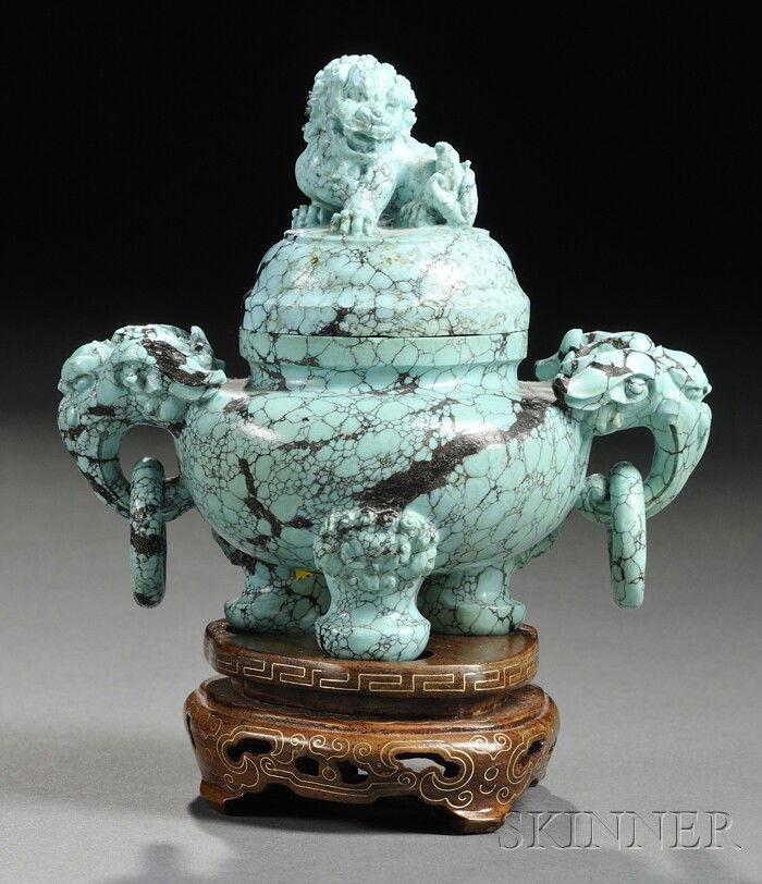 Turquoise Censer, China, the compressed globular b: Turquoise Censer, China, the compressed globular body supported on tripod feet with animal mask finials, flanked by foo dog head lugs suspending loose rings, the domed cover surmounted by a foo dog fi