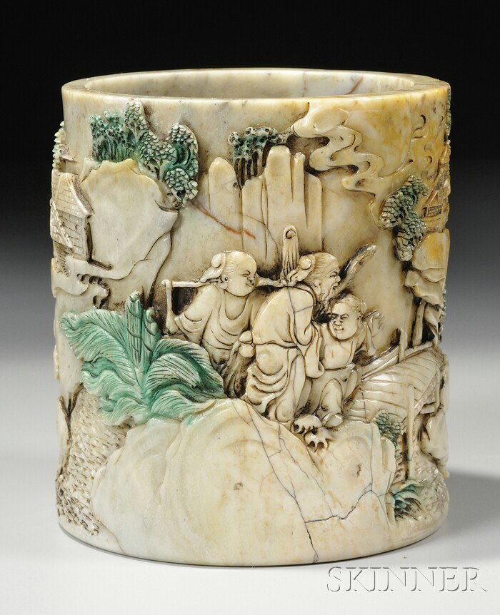 Soapstone Brush Pot, China, late 19th/early 20th c: Soapstone Brush Pot, China, late 19th/early 20th century, cylindrical, the sides finely carved in a continuous relief depicting figures in various attitudes in a rustic landscape, trees and plants dye