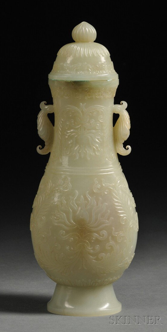 Jade Covered Vase, China, 19th century, of archai: Jade Covered Vase, China, 19th century, of archaic drinking vessel hu shape, finely carved in low relief in the Mughal style with stylized lotus scrolls to each side, flanked by acanthus leaf lugs, do