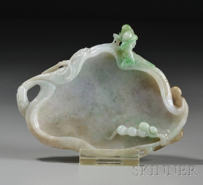 Jadeite Tray, China,19th century, in the form of : Jadeite Tray, China,19th century, in the form of a leaf with curled edges, with relief-carved leafy and fruiting sprigs, the stone of semi-translucent emerald green and white color with russet areas, 