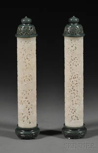 Pair of Jade Incense Cylinders, China, 19th centu: Pair of Jade Incense Cylinders, China, 19th century, each elongated white jade body carved in openwork with boys at play amidst lotus flowers and leaves, with spinach green jade reticulated lids and s