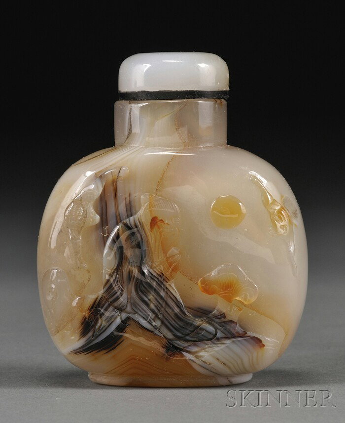 Agate Snuff Bottle, China, the rounded body carve: Agate Snuff Bottle, China, the rounded body carved in high relief with the seated figure of Shoulao in a rocky landscape, with bats, full moon, and lingzhi fungus nearby, agate stopper, lg. 2 1/4 in.