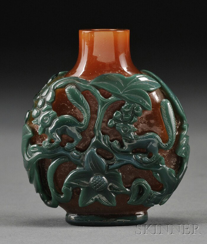 Overlay Glass Snuff Bottle, China, of flattened r: Overlay Glass Snuff Bottle, China, of flattened round shape, green carved to orange-brown color with relief carving of squirrels amidst leafy and flowering branches, lg. 2 1/4 in.