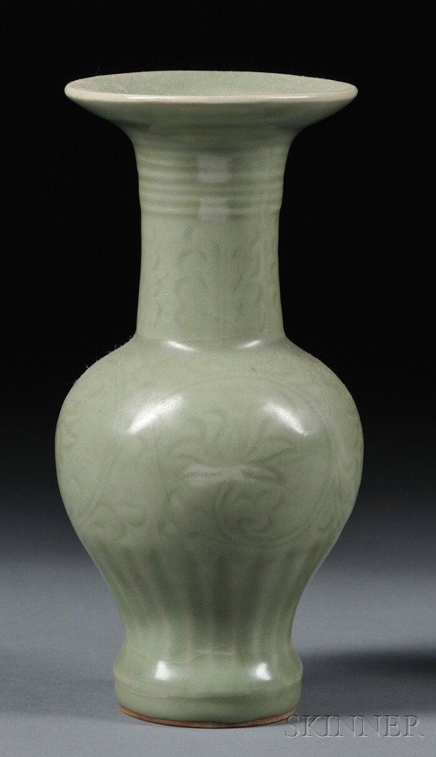 Celadon Vase, China, Ming dynasty (1368-1644) or : Celadon Vase, China, Ming dynasty (1368-1644) or earlier, Longquan ware, flaring trumpet mouth with oviform holder, decoration of carved floral scrolling, covered with an olive green glaze, ht. 8 1/2 