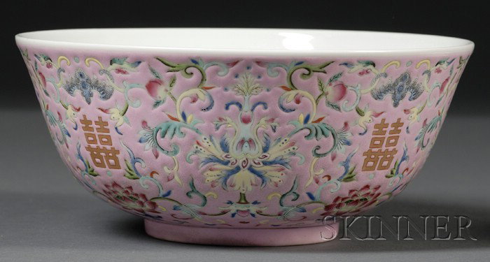 Large Famille Rose Bowl, China, 19th century, pai: Large Famille Rose Bowl, China, 19th century, painted on the exterior with four shuangxi characters, reserved on a pale pink ground with stylized lotus meanders interspersed with bats, dia. 8 1/4, ht.