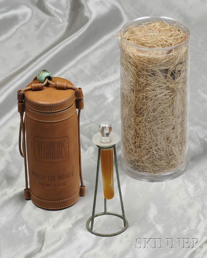 Two Vials of "Verdigris" Boutique Fragrance, Robert: Two Vials of "Verdigris" Boutique Fragrance, Robert Lee Morris, each quarter-ounce of scent in a limited edition etched frosted glass vial, oxidized brass tripod, and tubular leather case. Note: The f