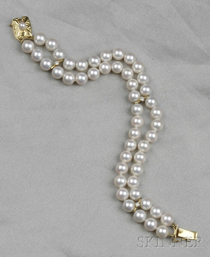 Cultured Pearl and Diamond Bracelet, Mikimoto, the: Cultured Pearl and Diamond Bracelet, Mikimoto, the double strand comprised of forty-eight pearls each measuring approx. 6.50 mm, spaced with three gold bars set with full-cut diamond melee accents, co