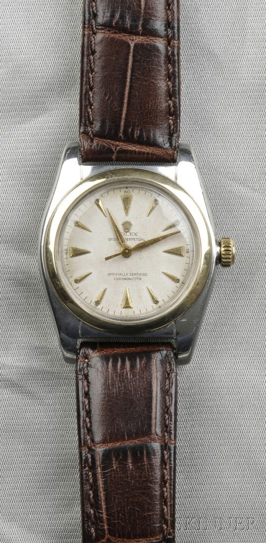 Stainless Steel "Bubble Back" Wristwatch, Rolex, ": Stainless Steel "Bubble Back" Wristwatch, Rolex, "Oyster Perpetual," the ivory-tone dial with abstract numeral indicators, no. 631602, ref. no. 5011, completed by a brown strap.