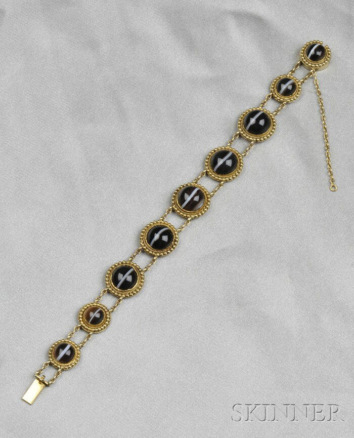Antique Gold and Banded Agate Bracelet, designed a: Antique Gold and Banded Agate Bracelet, designed as cabochon agates within ropetwist and beaded frames, graduating in size, lg. 7 in.