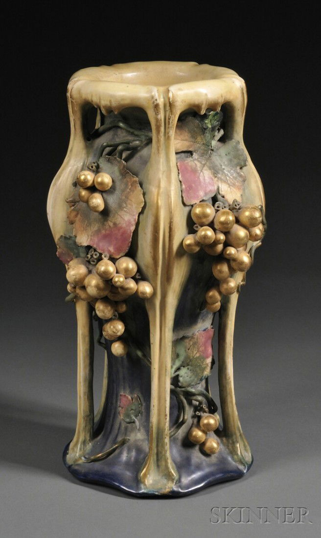Amphora Pottery Vase Glazed molded earthenware Aus: Amphora Pottery Vase Glazed molded earthenware Austria, early 20th century Raised rim on bulbous shoulder with four long ribbed protrusions joining at the base, the sides with applied clusters of grap