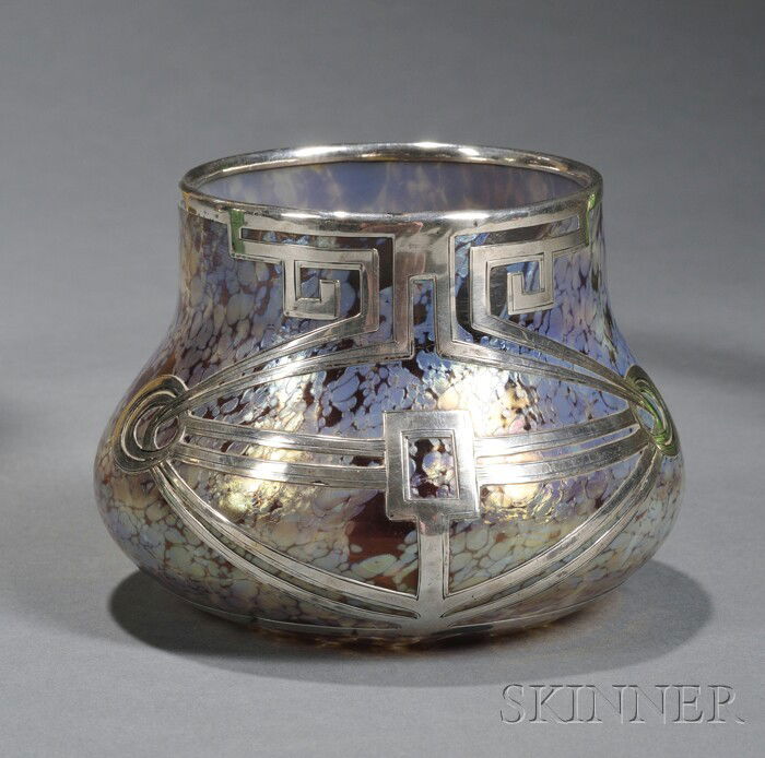 Loetz Silver Overlay Vase Silver, iridescent glass: Loetz Silver Overlay Vase Silver, iridescent glass Austria, early 20th century Raised rim on squat vessel with gold papillon surface overlaid with sinuous and geometric silver overlay, polished pontil