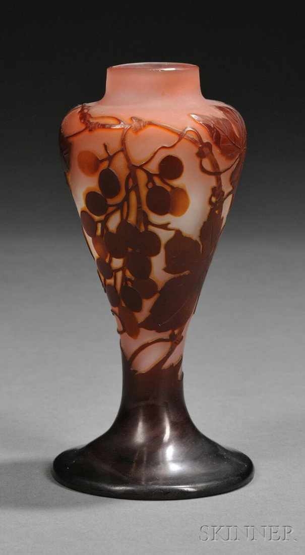 Galle Cameo Glass Vase Art glass France, 1914-36 C: Galle Cameo Glass Vase Art glass France, 1914-36 Cameo decorated with grapes, leaves, and vines in maroon cut to pink ground, signed Galle in the cameo, some rim nicks possibly from a metal mount, ht.