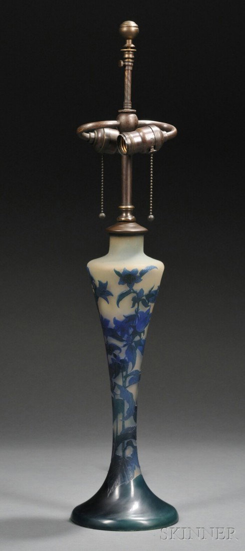 Galle Cameo Glass Table Lamp Art glass and patinat: Galle Cameo Glass Table Lamp Art glass and patinated metal France, 20th century Vasiform body cameo decorated with green cut to blue on peach colored ground, signed Galle in the cameo, fitted with a d