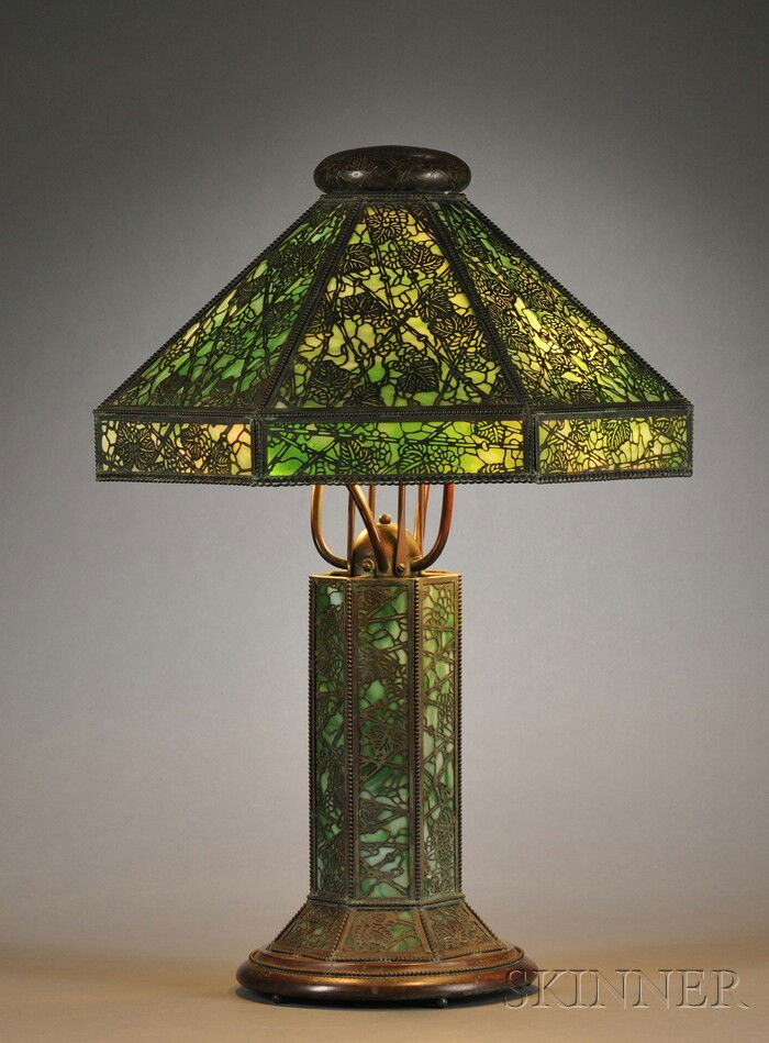 Table Lamp Attributed to Riviere Studios Metal ove: Table Lamp Attributed to Riviere Studios Metal overlay and slag glass United States, early 20th century Etched metal cap over seven-panel reticulated metal overlay shade with drop apron, in a leafy vi
