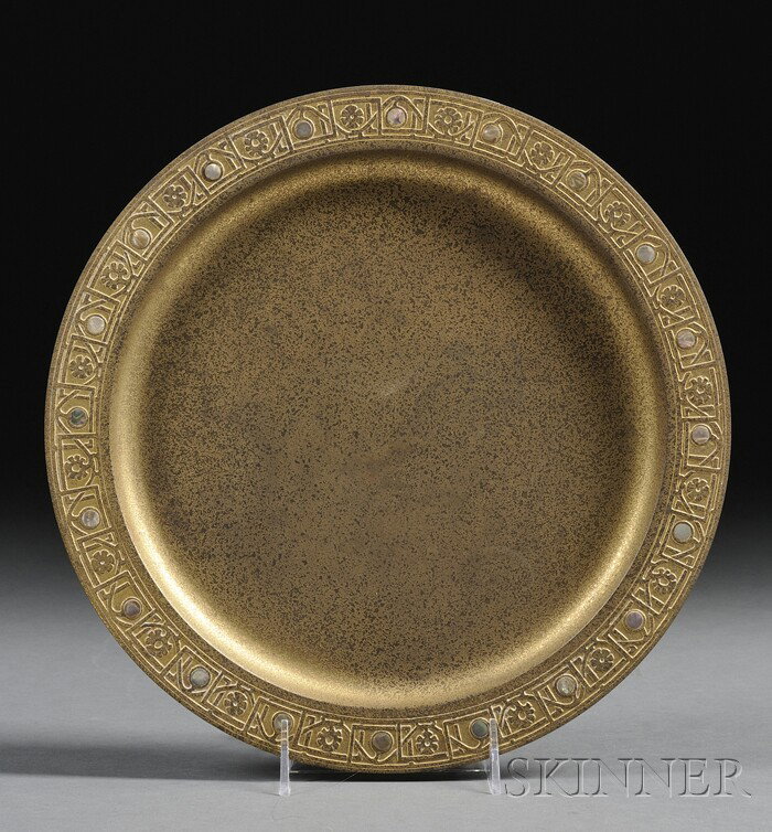 Tiffany Studios Tray Gilt bronze and inlaid abalon: Tiffany Studios Tray Gilt bronze and inlaid abalone New York, 1902-38 Round etched metal tray with raised geometric and blossom rim border with inlaid abalone disks, impressed Tiffany Studios New York