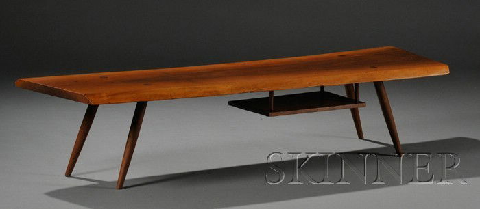 Early George Nakashima (1905-1990) Coffee Table Bl: Early George Nakashima (1905-1990) Coffee Table Black walnut New Hope, Pennsylvania, c. 1952 Free beveled edge rectangular form with center grained and tapered legs fitted with a shelf on underside su