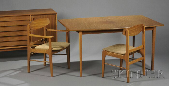 Stanley Dining Table, Six Chairs, and a Credenza H: Stanley Dining Table, Six Chairs, and a Credenza Hardwood and hardwood veneers Danish Forum line, 1960s Rectangular top table on tapering cylindrical legs, with additional leaf in darker stain, one ar