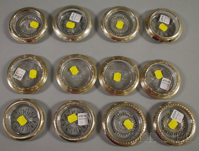 Twelve Sterling Silver-rimmed Crystal Coasters, inc: Twelve Sterling Silver-rimmed Crystal Coasters, including a set of four Amston, a pair of Crown, Whiting, and Laben.