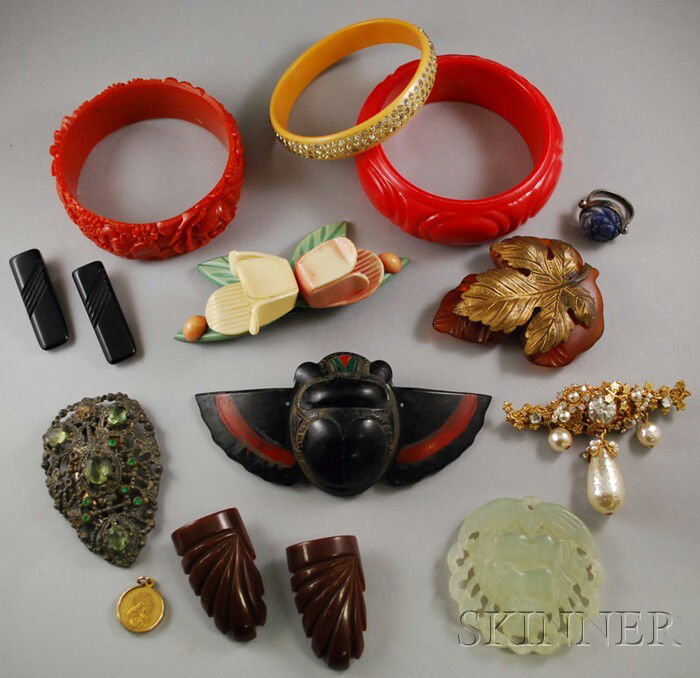 Group of Bakelite and Costume Jewelry, including a: Group of Bakelite and Costume Jewelry, including a Miriam Haskell pearl brooch, carved bangles, clips, and other items.