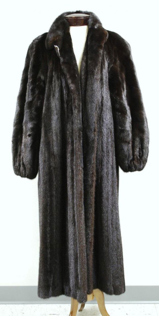 Lady's Long Mink Coat, unlabeled, button closure: Lady's Long Mink Coat, unlabeled, button closure at collar and hook closures at chest, embroidered lining, elasticized wrists, lg. 47 in., approx. size large.