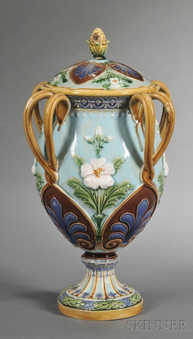 Minton Majolica Vase and Cover, England, c. 1862, w: Minton Majolica Vase and Cover, England, c. 1862, with four double handles, polychrome enamel decorated with panels of blossoms and palmettes, impressed mark, ht. 11 in.