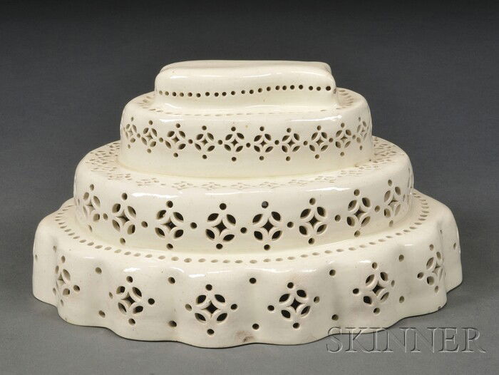 Creamware Culinary Mold, England, late 18th century: Creamware Culinary Mold, England, late 18th century, three-tier oval form with scalloped foot and pierced walls, the top central mold modeled as a fish, lg. 8 1/2, ht. 4 3/4 in.