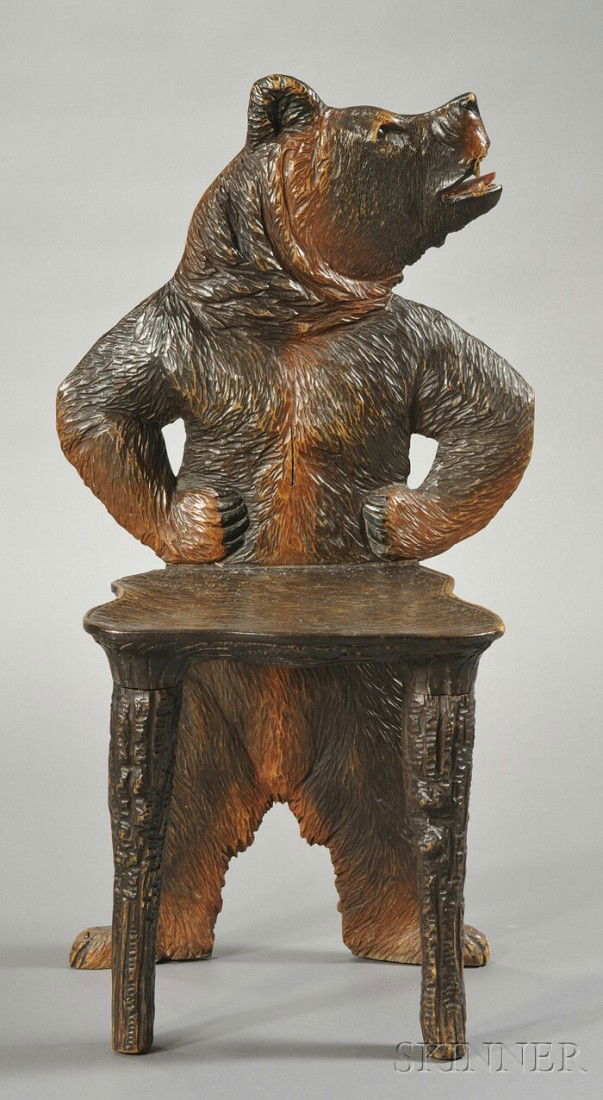 Child's Black Forest Carved Bear-form Chair, secon: Child's Black Forest Carved Bear-form Chair, second half 19th century, the backrest carved and painted as a bear's head and torso, with hands on waist, with bear-form rear legs, and seat and front leg