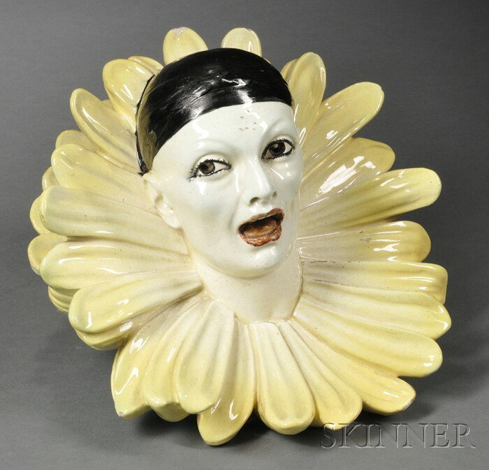 Art Deco Ceramic Wall Pocket with a Clown, France,: Art Deco Ceramic Wall Pocket with a Clown, France, 20th century, the clown in whiteface, his collar formed by yellow flower petals, dia. 11 in.