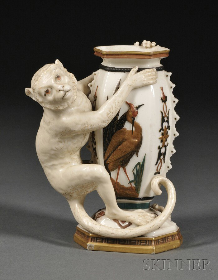 Royal Worcester Porcelain Vase with Monkey, Englan: Royal Worcester Porcelain Vase with Monkey, England, 1872, modeled as a monkey holding a hexagonal vase adorned with cranes, ht. 6 15/16 in.