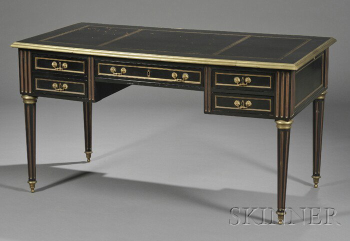 Louis XVI-style Ormolu Mounted, Ebonized, and Parc: Louis XVI-style Ormolu Mounted, Ebonized, and Parcel-gilt Desk, the rectangular top with inset leather writing surface, over one side with four drawers, the other with five sham drawers, on circular,